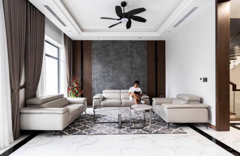 Công trình thi công nội thất phòng khách biệt thự hiện đại với đồ nội thất sofa bọc da sang trọng tại Nghệ An Thi công nội thất phòng khách hiện đại, đơn giản và ấn tượng