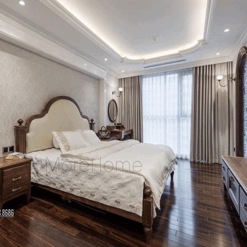 Mẫu giường ngủ đẹp với thiết kế đầu giường cách điệu bọc da màu trắng mang đến vẻ đẹp tinh tế cho không gian căn phòng của gia chủ. Thiết kế phòng ngủ gỗ óc chó