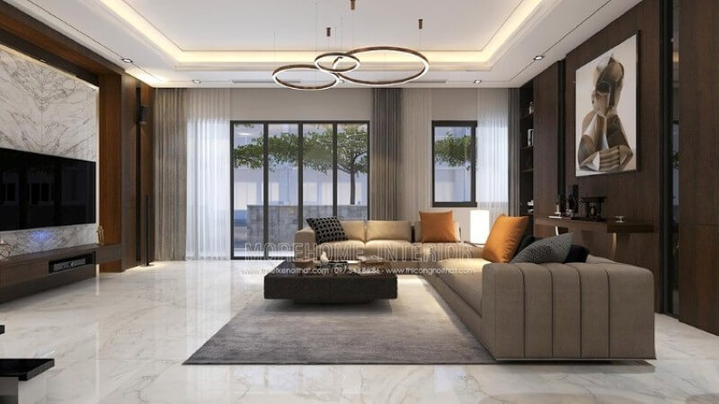 Bố trí nội thất phòng khách biệt thự rộng nổi bật với phong cách hiện đại nổi bật bộ sofa góc lớn cách điệu với đường kẻ sọc trang trí đẹp mắt.